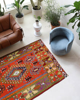 Vintage kilim rug in living room setting, bright colors, wild shaman, soft rug, bold color, Portland, Oregon, rug store, rug shop, local shop, vintage rug, modern kilim, warm colors