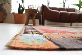 Vintage kilim rug in living room setting, old rug, antique rug, pastel colors, faded colors, Turkish rug, vintage rug, soft rug, Portland, Oregon, rug store, rug shop, local shop, earthy tones, earthy colors, warm colors