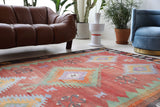 Vintage kilim rug in living room setting, old rug, antique rug, pastel colors, faded colors, Turkish rug, vintage rug, soft rug, Portland, Oregon, rug store, rug shop, local shop, earthy tones, earthy colors, warm colors