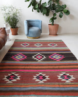 Vintage kilim rug in living room setting, bright colors, wild shaman, soft rug, bold color, Portland, Oregon, rug store, rug shop, local shop, vintage rug, modern kilim, warm colors