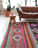 Vintage kilim rug in living room setting, bright colors, wild shaman, soft rug, bold color, Portland, Oregon, rug store, rug shop, local shop, vintage rug, modern kilim, warm colors