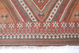 Vintage kilim rug in living room setting, old rug, antique rug, pastel colors, faded colors, Turkish rug, vintage rug, soft rug, Portland, Oregon, rug store, rug shop, local shop, earthy tones, earthy colors, warm colors