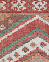 Vintage kilim rug in living room setting, old rug, antique rug, pastel colors, faded colors, Turkish rug, vintage rug, soft rug, Portland, Oregon, rug store, rug shop, local shop, earthy tones, earthy colors, warm colors