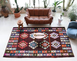 Vintage kilim rug in living room setting, bright colors, wild shaman, soft rug, bold color, Portland, Oregon, rug store, rug shop, local shop, vintage rug, modern kilim, warm colors