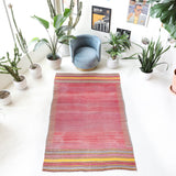 Vintage kilim rug in living room setting, old rug, antique rug, pastel colors, faded colors, Turkish rug, vintage rug, soft rug, Portland, Oregon, rug store, rug shop, local shop, earthy tones, earthy colors, warm colors