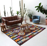 Vintage kilim rug in living room setting, bright colors, wild shaman, soft rug, bold color, Portland, Oregon, rug store, rug shop, local shop, vintage rug, modern kilim, warm colors