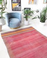 Vintage kilim rug in living room setting, old rug, antique rug, pastel colors, faded colors, Turkish rug, vintage rug, soft rug, Portland, Oregon, rug store, rug shop, local shop, earthy tones, earthy colors, warm colors