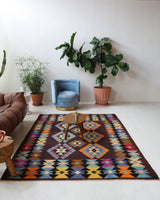 Vintage kilim rug in living room setting, bright colors, wild shaman, soft rug, bold color, Portland, Oregon, rug store, rug shop, local shop, vintage rug, modern kilim, warm colors