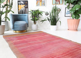 Vintage kilim rug in living room setting, old rug, antique rug, pastel colors, faded colors, Turkish rug, vintage rug, soft rug, Portland, Oregon, rug store, rug shop, local shop, earthy tones, earthy colors, warm colors