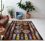 Vintage kilim rug in living room setting, bright colors, wild shaman, soft rug, bold color, Portland, Oregon, rug store, rug shop, local shop, vintage rug, modern kilim, warm colors