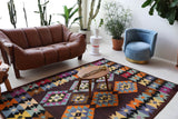 Vintage kilim rug in living room setting, bright colors, wild shaman, soft rug, bold color, Portland, Oregon, rug store, rug shop, local shop, vintage rug, modern kilim, warm colors