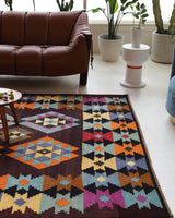 Vintage kilim rug in living room setting, bright colors, wild shaman, soft rug, bold color, Portland, Oregon, rug store, rug shop, local shop, vintage rug, modern kilim, warm colors