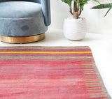 Vintage kilim rug in living room setting, old rug, antique rug, pastel colors, faded colors, Turkish rug, vintage rug, soft rug, Portland, Oregon, rug store, rug shop, local shop, earthy tones, earthy colors, warm colors
