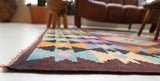 Vintage kilim rug in living room setting, bright colors, wild shaman, soft rug, bold color, Portland, Oregon, rug store, rug shop, local shop, vintage rug, modern kilim, warm colors