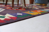 Vintage kilim rug in living room setting, bright colors, wild shaman, soft rug, bold color, Portland, Oregon, rug store, rug shop, local shop, vintage rug, modern kilim, warm colors