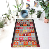 Vintage kilim rug in living room setting, bright colors, wild shaman, soft rug, bold color, Portland, Oregon, rug store, rug shop, local shop, vintage rug, modern kilim, warm colors