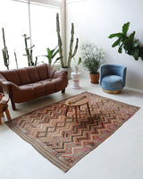 Vintage kilim rug in living room setting, old rug, antique rug, pastel colors, faded colors, Turkish rug, vintage rug, soft rug, Portland, Oregon, rug store, rug shop, local shop, earthy tones, earthy colors, warm colors