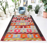 Vintage kilim rug in living room setting, bright colors, wild shaman, soft rug, bold color, Portland, Oregon, rug store, rug shop, local shop, vintage rug, modern kilim, warm colors