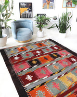 Vintage kilim rug in living room setting, bright colors, wild shaman, soft rug, bold color, Portland, Oregon, rug store, rug shop, local shop, vintage rug, modern kilim, warm colors