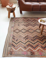 Vintage kilim rug in living room setting, old rug, antique rug, pastel colors, faded colors, Turkish rug, vintage rug, soft rug, Portland, Oregon, rug store, rug shop, local shop, earthy tones, earthy colors, warm colors