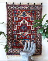 Vintage Turkish rug in a living room setting, pile rug, Turkish rug, vintage rug, portland, rug shop, bright colors, wild shaman, soft rug, bold color, Portland, Oregon, rug store, rug shop, local shop, antique rug