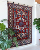 Vintage Turkish rug in a living room setting, pile rug, Turkish rug, vintage rug, portland, rug shop, bright colors, wild shaman, soft rug, bold color, Portland, Oregon, rug store, rug shop, local shop, antique rug