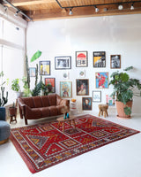 Vintage Turkish rug in a living room setting, pile rug, Turkish rug, vintage rug, portland, rug shop, bright colors, wild shaman, soft rug, bold color, Portland, Oregon, rug store, rug shop, local shop, antique rug