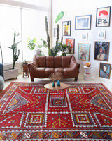 Vintage Turkish rug in a living room setting, pile rug, Turkish rug, vintage rug, portland, rug shop, bright colors, wild shaman, soft rug, bold color, Portland, Oregon, rug store, rug shop, local shop, antique rug