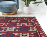 Vintage kilim rug in room decor setting, old rug, antique rug, pastel colors, faded colors, Turkish rug, vintage rug, soft rug, Portland, Oregon, rug store, rug shop, local shop, bold colors, bright colors, faded colors