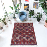 Vintage kilim rug in room decor setting, old rug, antique rug, pastel colors, faded colors, Turkish rug, vintage rug, soft rug, Portland, Oregon, rug store, rug shop, local shop, bold colors, bright colors, faded colors