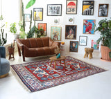 Vintage Turkish rug in a living room setting, pile rug, Turkish rug, vintage rug, portland, rug shop, bright colors, wild shaman, soft rug, bold color, Portland, Oregon, rug store, rug shop, local shop, antique rug