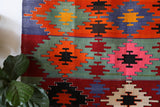 Vintage kilim rug in living room setting, bright colors, wild shaman, soft rug, bold color, Portland, Oregon, rug store, rug shop, local shop, vintage rug, modern kilim, warm colors