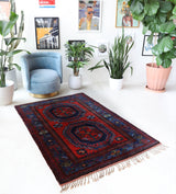 Vintage Turkish rug in a living room setting, pile rug, Turkish rug, vintage rug, portland, rug shop, bright colors, wild shaman, soft rug, bold color, Portland, Oregon, rug store, rug shop, local shop, antique rug