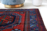 Vintage Turkish rug in a living room setting, pile rug, Turkish rug, vintage rug, portland, rug shop, bright colors, wild shaman, soft rug, bold color, Portland, Oregon, rug store, rug shop, local shop, antique rug