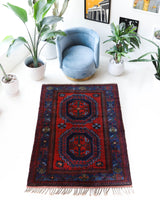 Vintage Turkish rug in a living room setting, pile rug, Turkish rug, vintage rug, portland, rug shop, bright colors, wild shaman, soft rug, bold color, Portland, Oregon, rug store, rug shop, local shop, antique rug