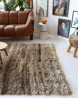 Vintage Turkish rug in a living room setting, pile rug, Turkish rug, vintage rug, portland, rug shop, bright colors, wild shaman, soft rug, bold color, Portland, Oregon, rug store, rug shop, local shop, shag rug, shaggy, plush,tulu rugs