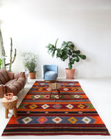 Vintage kilim rug in living room setting, bright colors, wild shaman, soft rug, bold color, Portland, Oregon, rug store, rug shop, local shop, vintage rug, modern kilim, warm colors