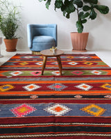 Vintage kilim rug in living room setting, bright colors, wild shaman, soft rug, bold color, Portland, Oregon, rug store, rug shop, local shop, vintage rug, modern kilim, warm colors