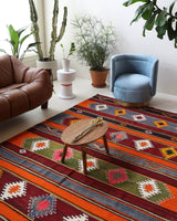 Vintage kilim rug in living room setting, bright colors, wild shaman, soft rug, bold color, Portland, Oregon, rug store, rug shop, local shop, vintage rug, modern kilim, warm colors