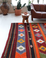 Vintage kilim rug in living room setting, bright colors, wild shaman, soft rug, bold color, Portland, Oregon, rug store, rug shop, local shop, vintage rug, modern kilim, warm colors