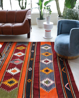 Vintage kilim rug in living room setting, bright colors, wild shaman, soft rug, bold color, Portland, Oregon, rug store, rug shop, local shop, vintage rug, modern kilim, warm colors