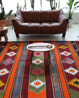 Vintage kilim rug in living room setting, bright colors, wild shaman, soft rug, bold color, Portland, Oregon, rug store, rug shop, local shop, vintage rug, modern kilim, warm colors