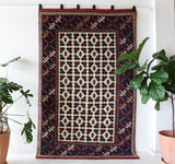 Vintage Turkish rug in a living room setting, pile rug, Turkish rug, vintage rug, portland, rug shop, bright colors, wild shaman, soft rug, bold color, Portland, Oregon, rug store, rug shop, local shop, antique rug