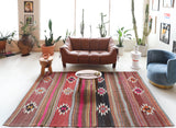 Vintage kilim rug in room decor setting, old rug, antique rug, pastel colors, faded colors, Turkish rug, vintage rug, soft rug, Portland, Oregon, rug store, rug shop, local shop, bold colors, bright colors, faded colors