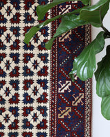 Vintage Turkish rug in a living room setting, pile rug, Turkish rug, vintage rug, portland, rug shop, bright colors, wild shaman, soft rug, bold color, Portland, Oregon, rug store, rug shop, local shop, antique rug