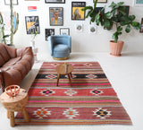 Vintage kilim rug in room decor setting, old rug, antique rug, pastel colors, faded colors, Turkish rug, vintage rug, soft rug, Portland, Oregon, rug store, rug shop, local shop, bold colors, bright colors, faded colors