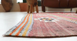 Vintage kilim rug in room decor setting, old rug, antique rug, pastel colors, faded colors, Turkish rug, vintage rug, soft rug, Portland, Oregon, rug store, rug shop, local shop, bold colors, bright colors, faded colors