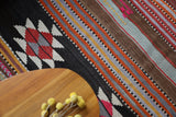 Vintage kilim rug in room decor setting, old rug, antique rug, pastel colors, faded colors, Turkish rug, vintage rug, soft rug, Portland, Oregon, rug store, rug shop, local shop, bold colors, bright colors, faded colors