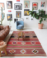 Vintage kilim rug in room decor setting, old rug, antique rug, pastel colors, faded colors, Turkish rug, vintage rug, soft rug, Portland, Oregon, rug store, rug shop, local shop, bold colors, bright colors, faded colors