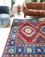 Vintage Turkish rug in a living room setting, pile rug, Turkish rug, vintage rug, portland, rug shop, bright colors, wild shaman, soft rug, bold color, Portland, Oregon, rug store, rug shop, local shop, antique rug